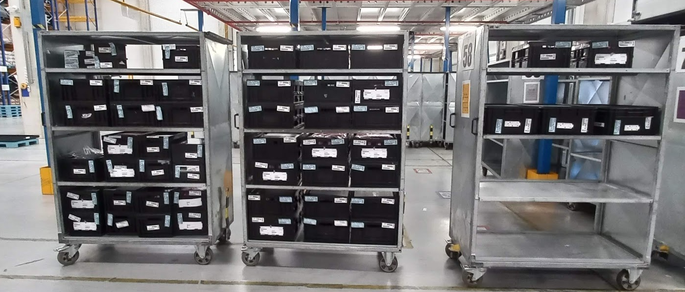 Boxes waiting for scanning on trolley